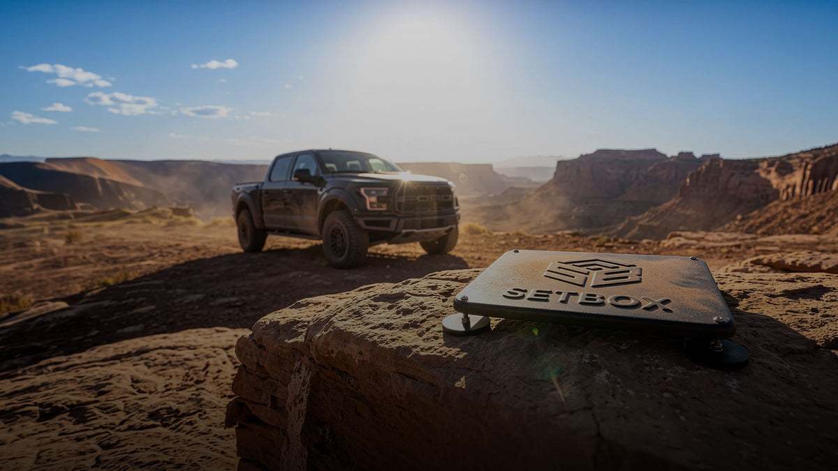 Pickup truck on a mountain highway with the SETBOX housing on the roof