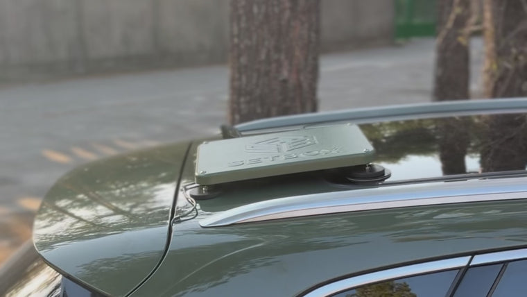 The SETBOX unit seated on the car roof, ready to drive