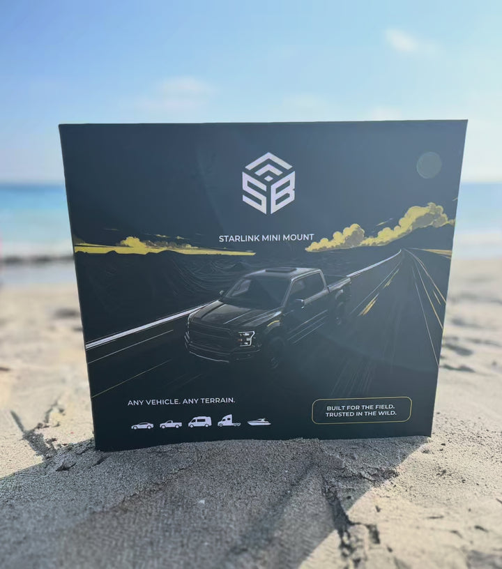 The SETBOX retail box standing in the sand at the shore, sea and sky behind