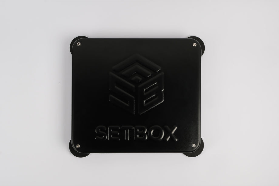 SETBOX housing in black, seen from above with the embossed logo
