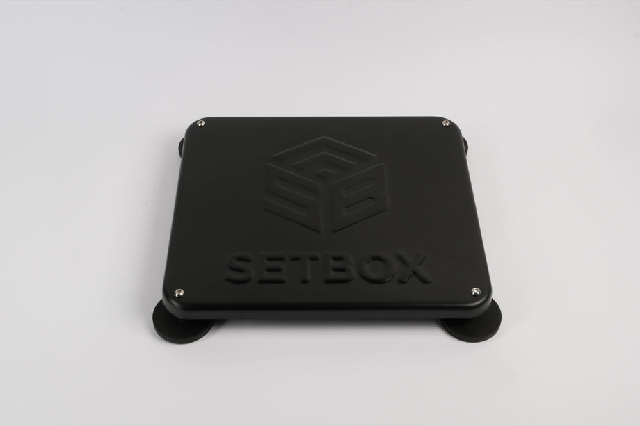 SETBOX housing in black, angled view on its magnetic feet