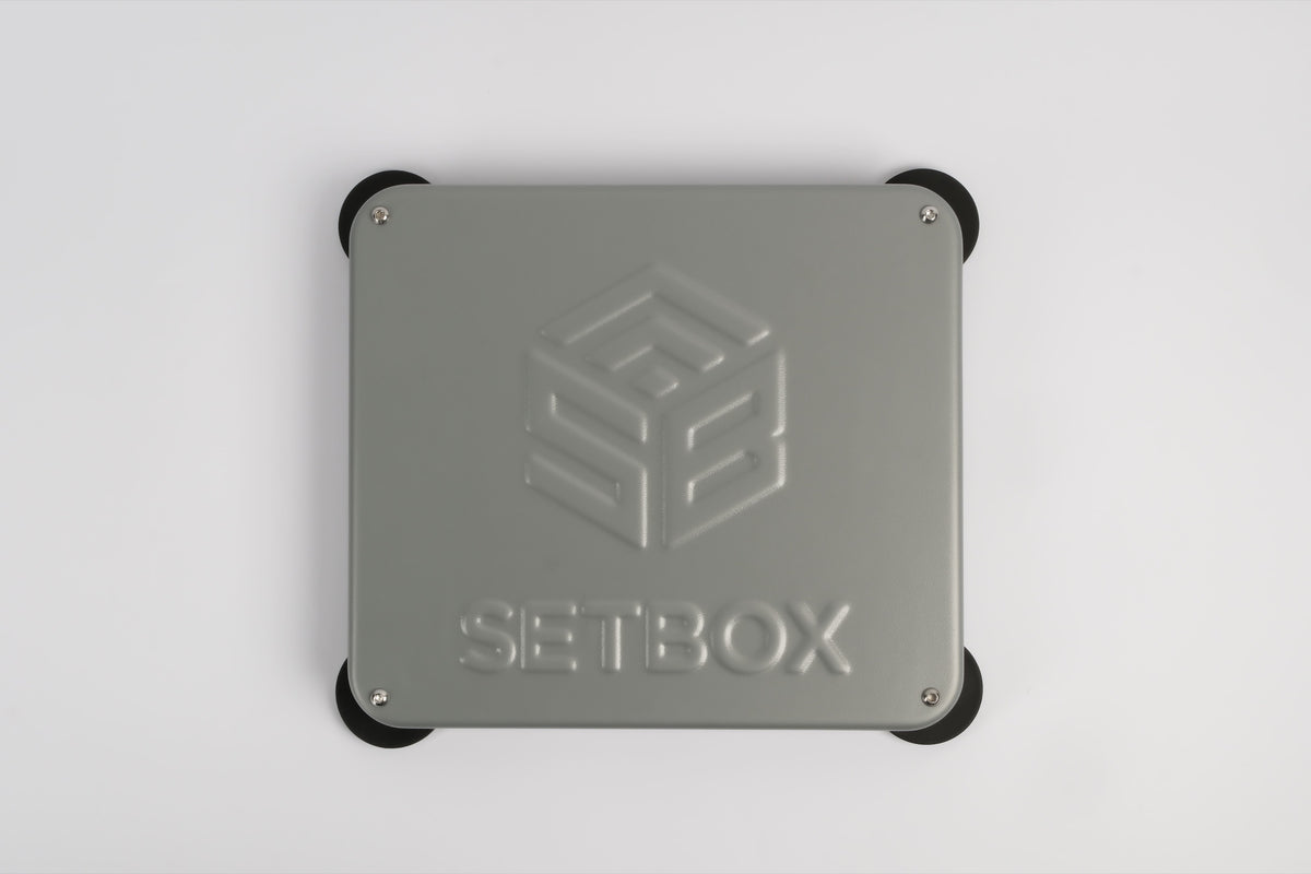 SETBOX housing in grey, seen from above with the embossed logo
