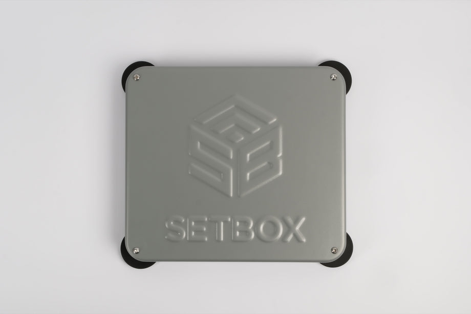 SETBOX housing in grey, seen from above with the embossed logo