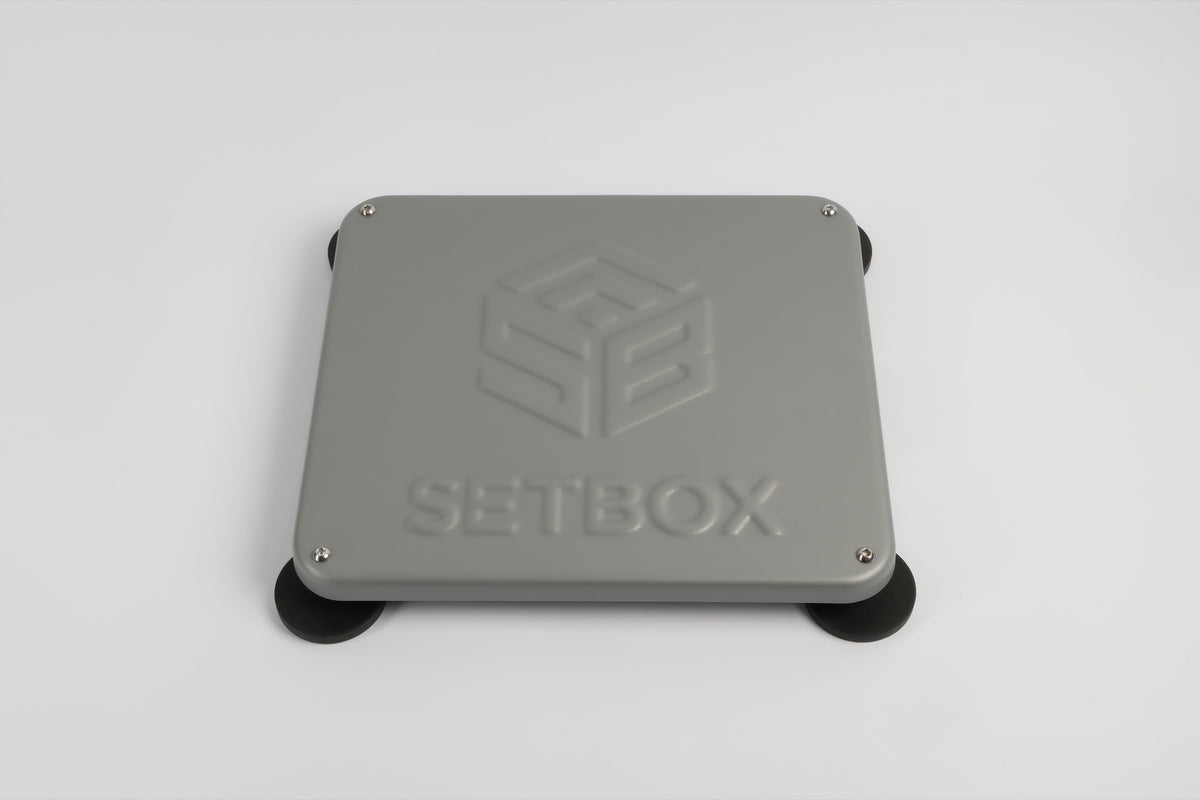 SETBOX housing in grey, angled view on its magnetic feet