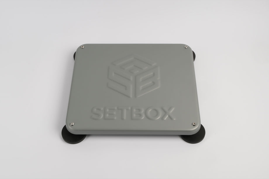 SETBOX housing in grey, angled view on its magnetic feet
