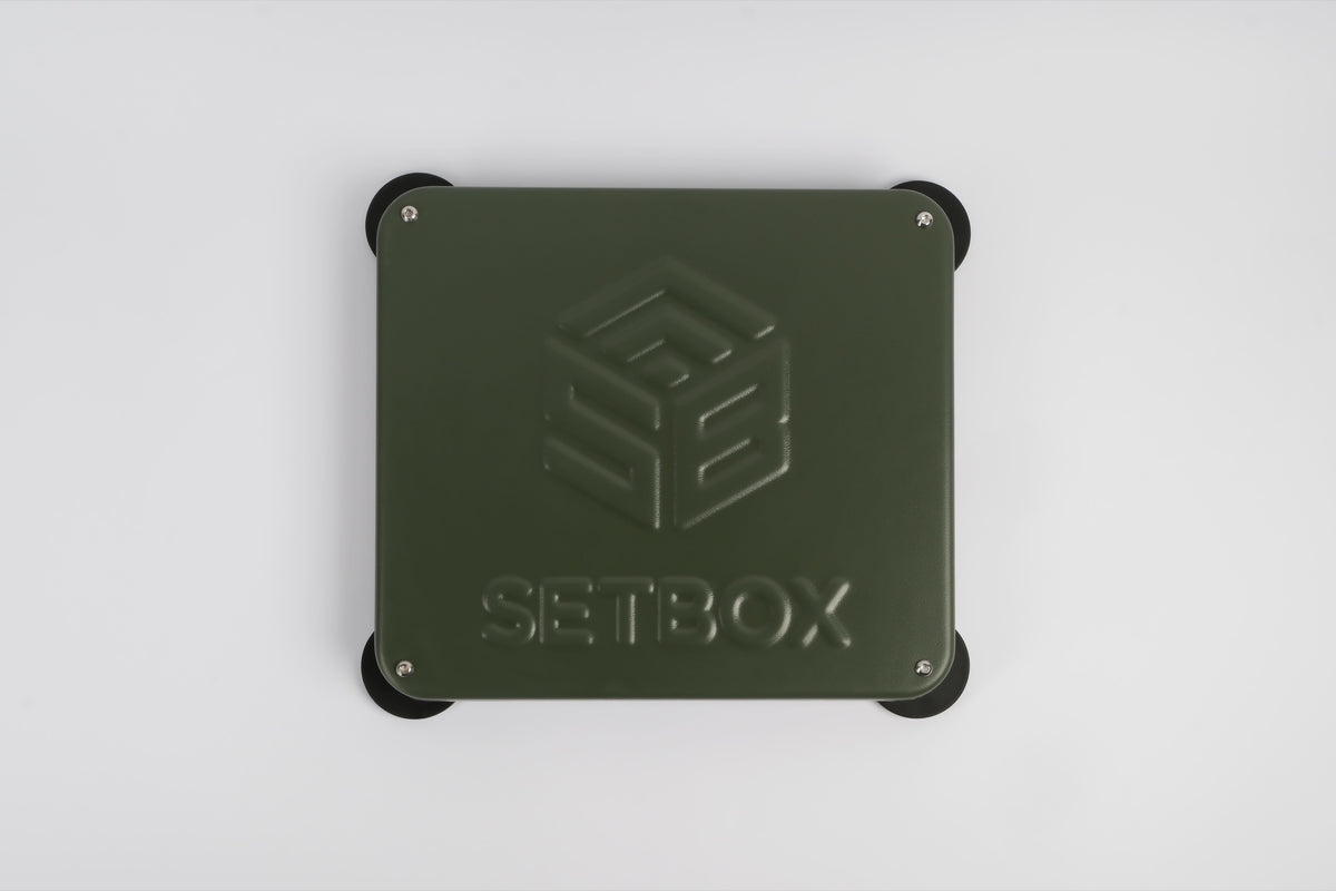 SETBOX housing in olive, seen from above with the embossed logo