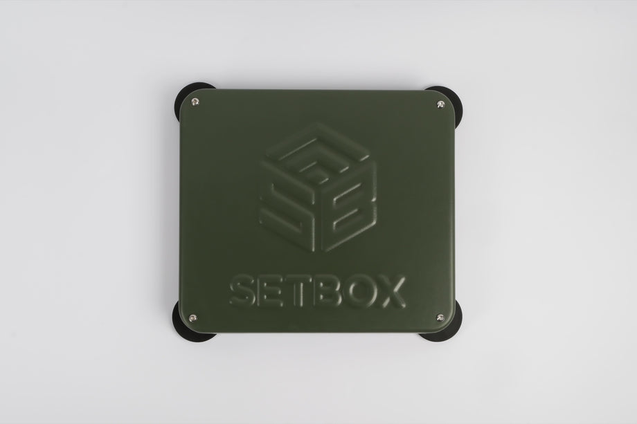 SETBOX housing in olive, seen from above with the embossed logo