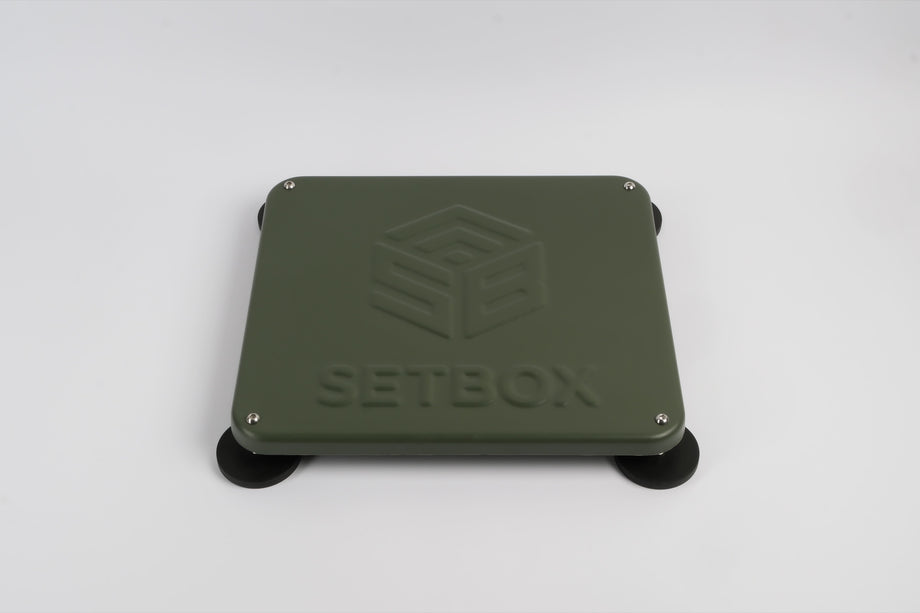 SETBOX housing in olive, angled view on its magnetic feet