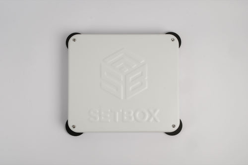 SETBOX housing in white, seen from above with the embossed logo